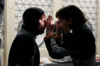 French astronaut and physician Amelie Durand (played by Clementine Poidatz) performs a health exam on Cmdr. Ben Sawyer after he becomes injured while landing on the Red Planet in National Geographic's "Mars" miniseries.