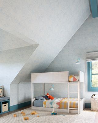 A child's bedroom with quilting on bunk beds