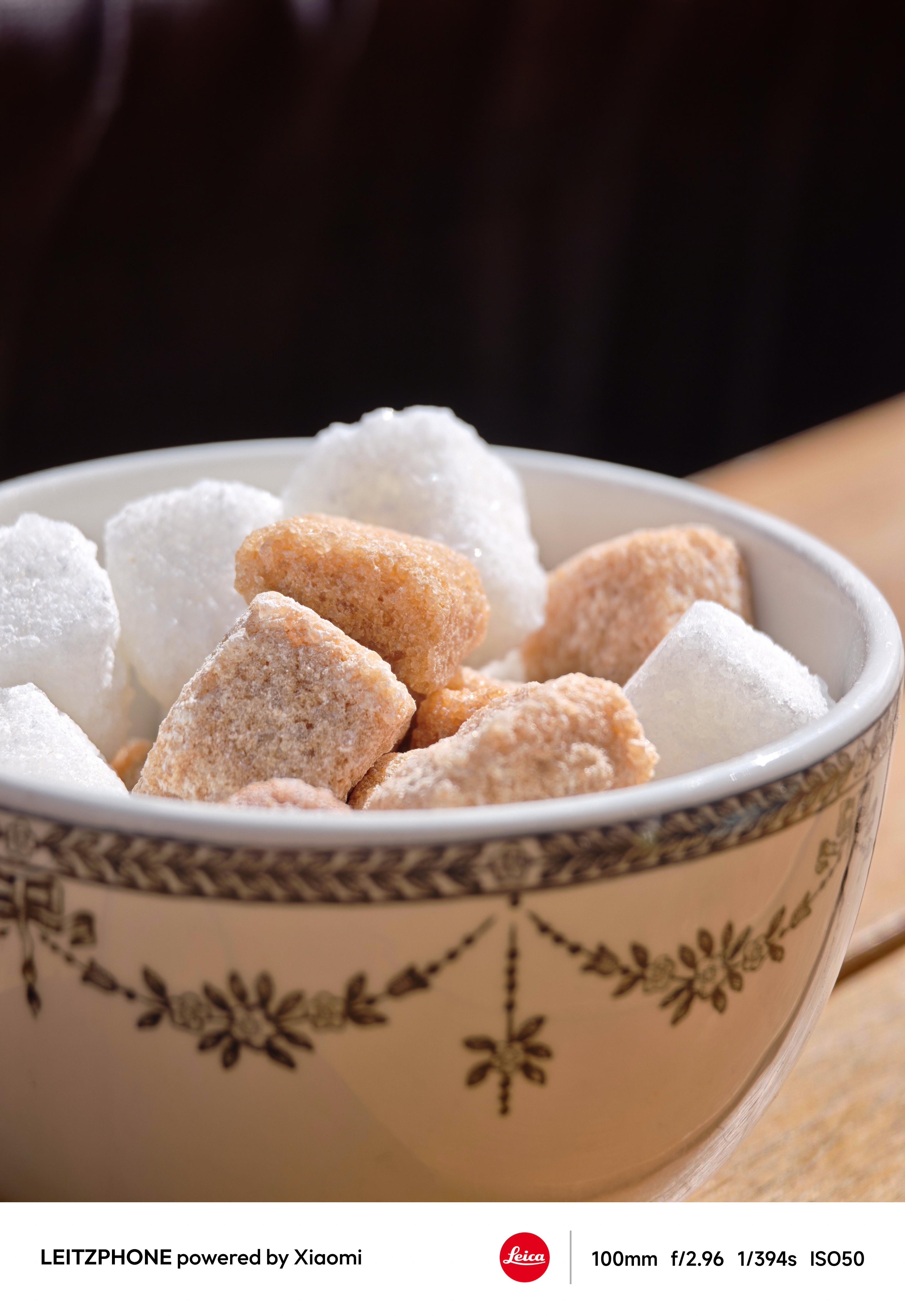 Bowl of white and brown sugar cubes on a table