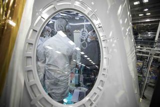 SpaceX's ECLSS (environmental control and life support system) Module tests the systems that will protect astronauts who travel to the International Space Station on the company's Crew Dragon spacecraft. Here, engineers work inside the module at the company's headquarters in California.