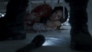 A bloodied Megan Fox hiding in a crawlspace in Till Death