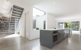The house's super-sized openings and briliant white colour make for a light and airy environment