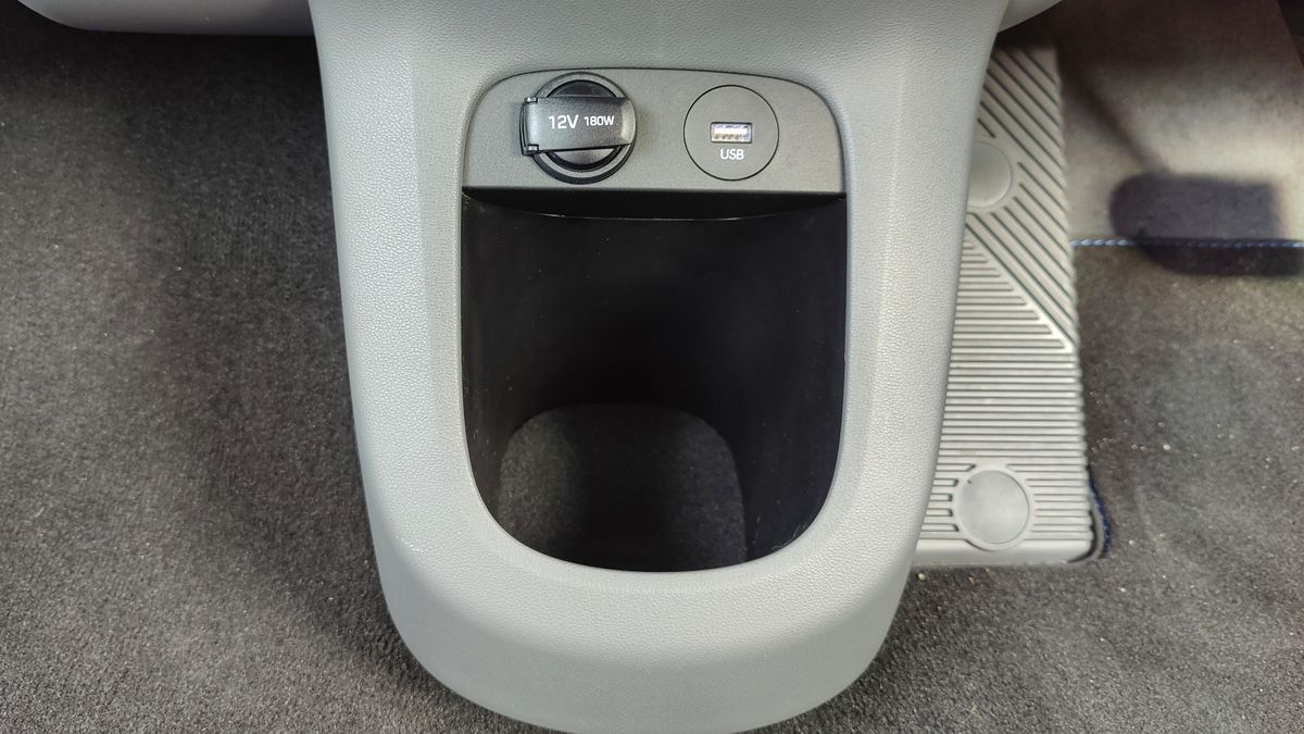 USB port, 12v port and cubby hole between front footwells