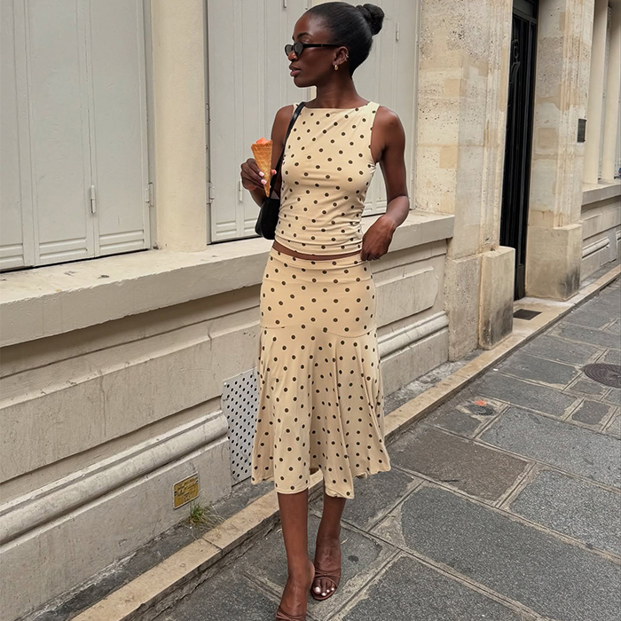 liv wears a white skirt set with polka dots