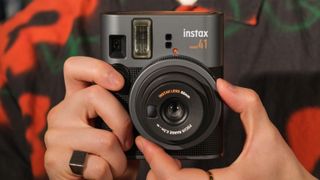 Fujifilm Instax Mini 41 instant camera held in a hand