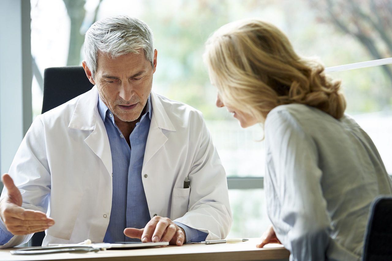 Doctor consulting patient in clinic