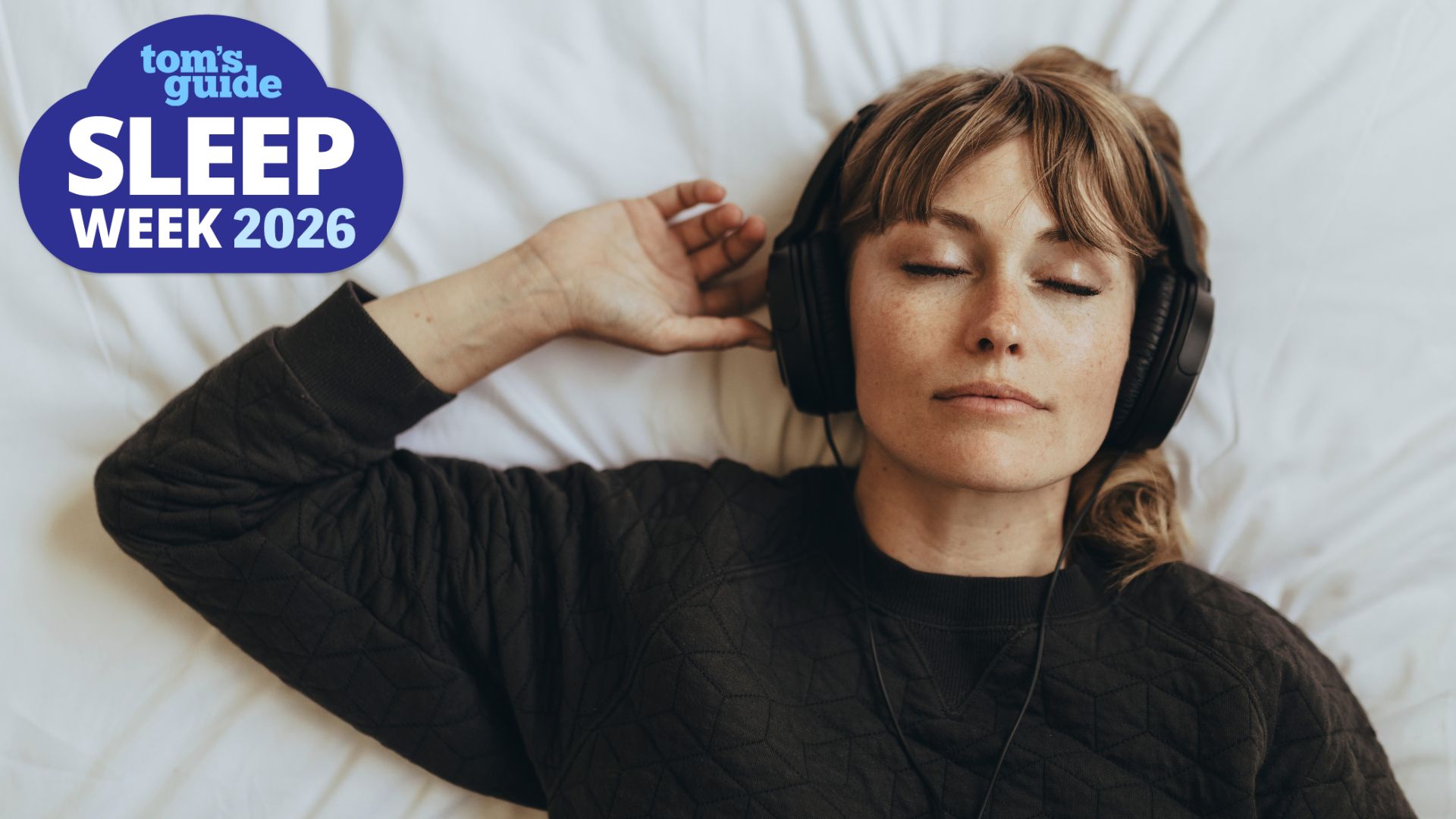 An image of the woman listening to white noise through headphones while sleeping. In the top left foreground, a Sleep Week 2026 badge can be seen. 