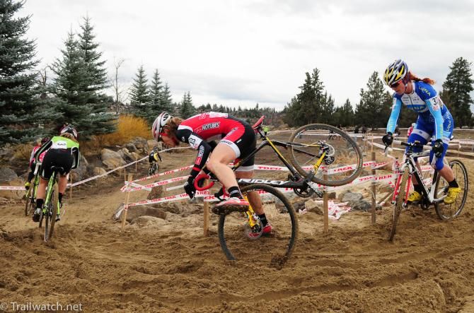 Mical Dyck (NoTubes) flying over her handlebars in the deep sand