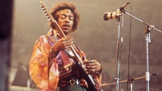 Jimi Hendrix plays London's Royal Albert Hall in 1969, and is lost in the moment as he plays a rhythm figure on his Fender Stratocaster.