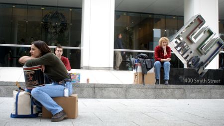 Employees leaving Enron office after company collapse