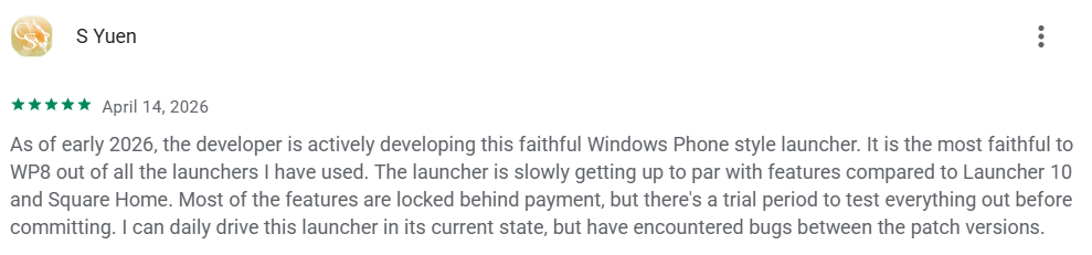User review of a Windows Phone-style launcher, rated five stars, dated April 14, 2026. The reviewer praises its development but notes some payment-locked features and bugs.