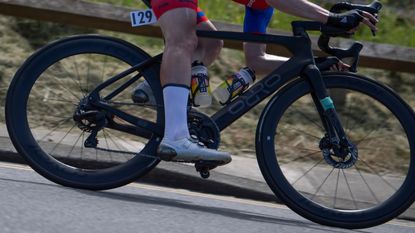 a rider descends on an orro bike