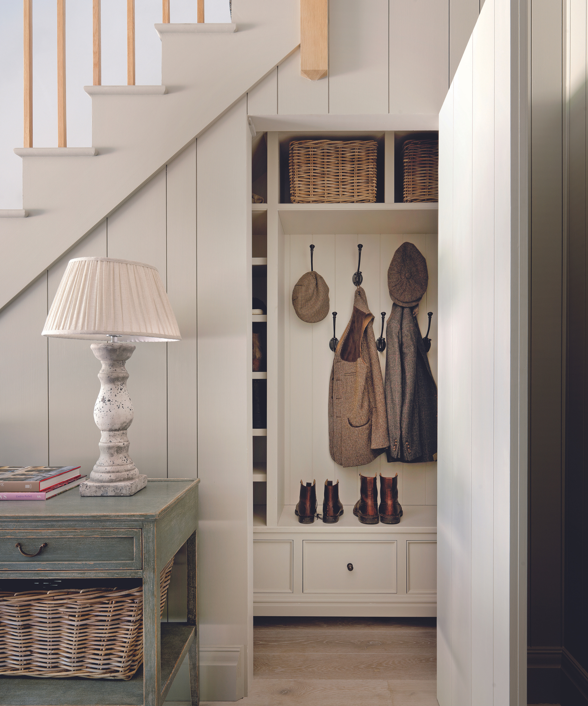 under the stairs storage being used as a boot room