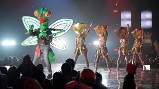 Mantis performs during the Battle of the Saved on The Masked Singer season 9