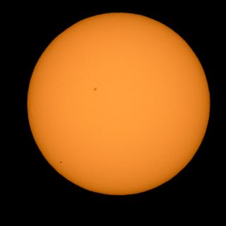 The planet Mercury can be seen crossing the disk of the sun (it appears as a black circle in the lower-left quadrant) on May 9, 2016. Image taken from Boyertown, Pennsylvania.