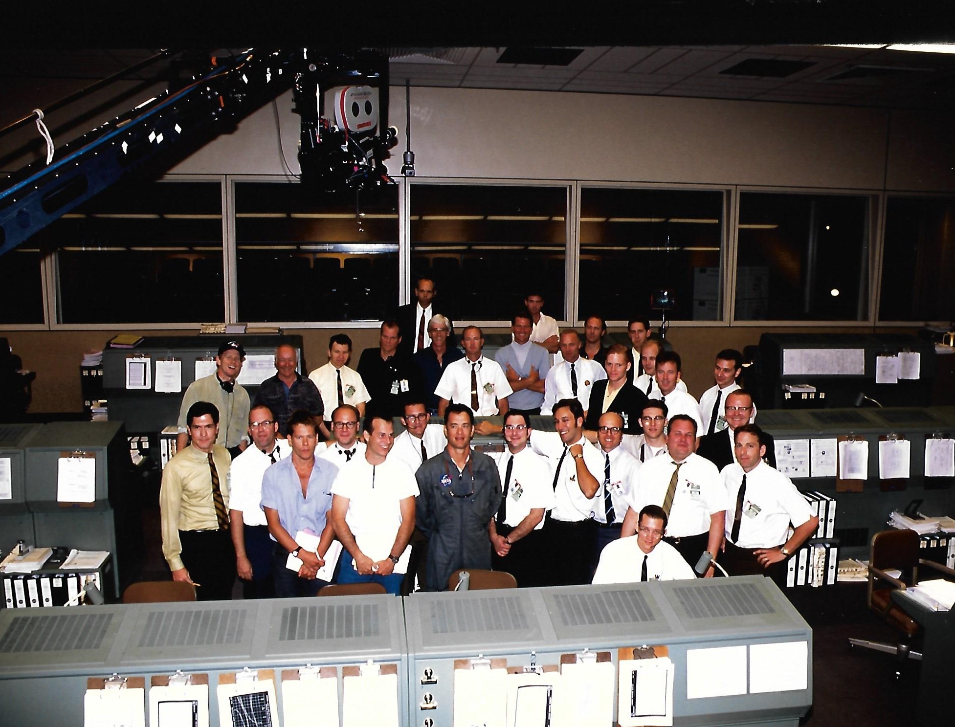 a group portrait in a room filled with banks of computers