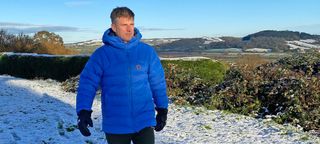 Man wearing Fjällräven Expedition Mid Winter Jacket in the snow