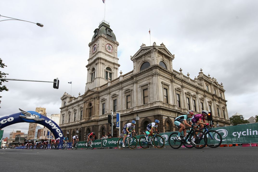 The riders pass through for another lap