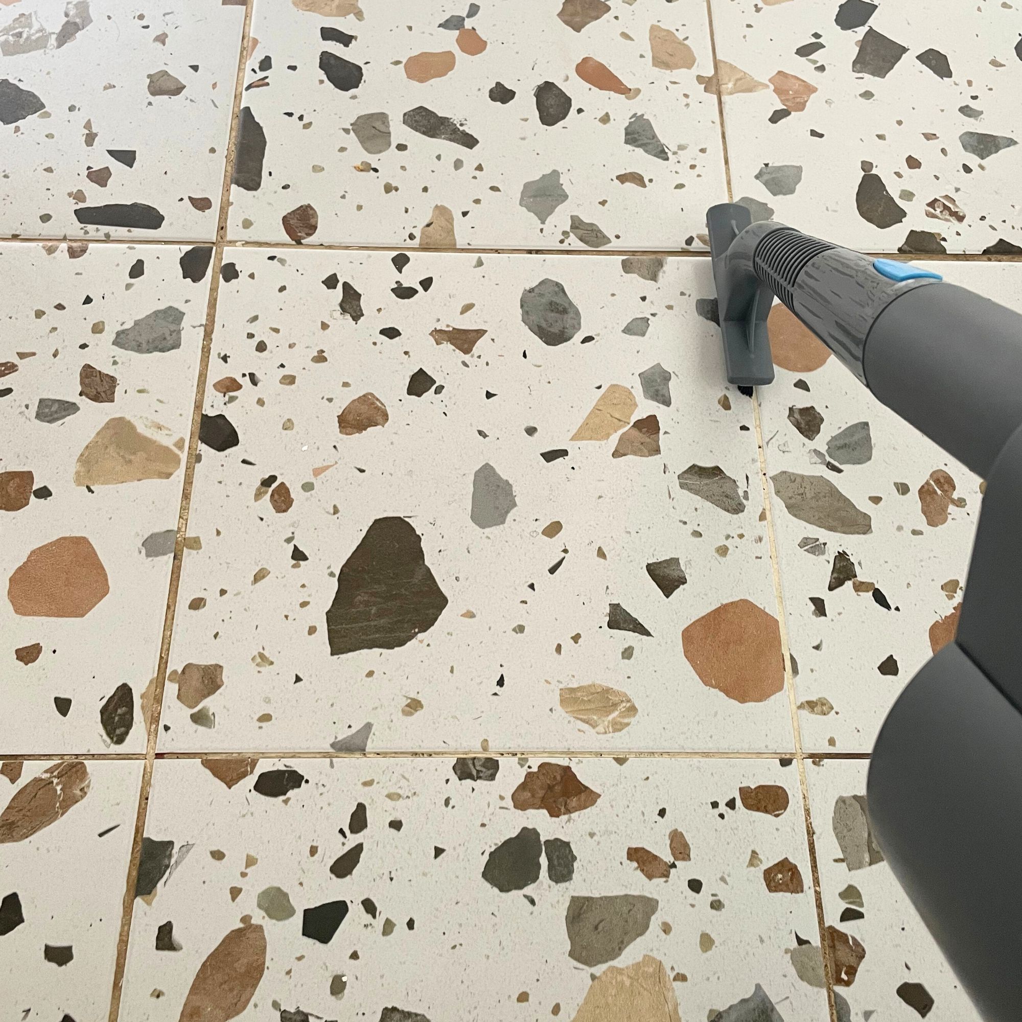 Using the Minky Opti-Clean Steam Cleaner grout tool on terrazzo tiles