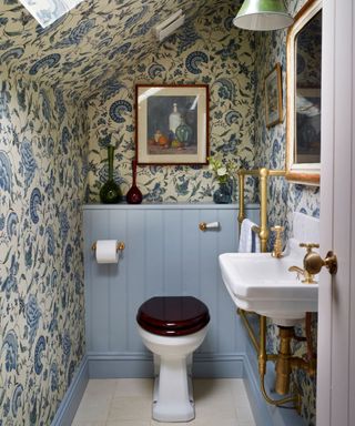 Cottage style with wallpaper applier on the walls and sloping ceiling
