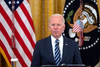 President Biden stood at a lectern in the White House