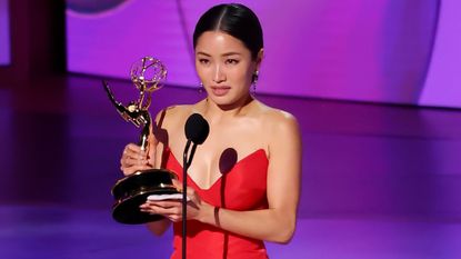 Anna Sawai accepts her award at the 2024 Emmys.