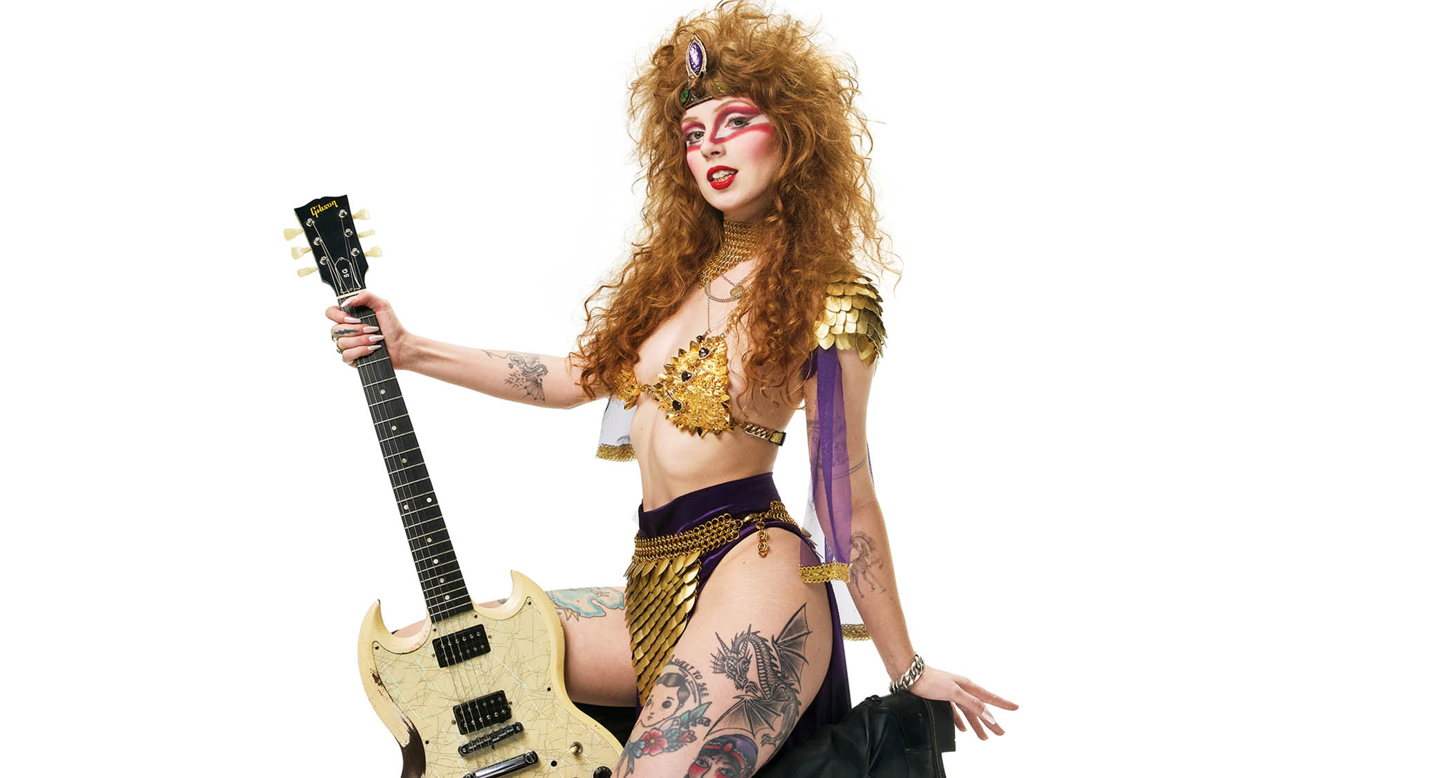 Castle Rat frontwoman Riley Pinkerton poses in her stagewear with her trusty white Gibson SG.
