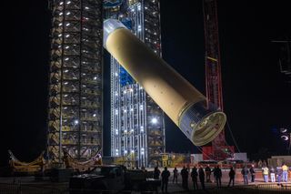 A structural test article for NASA's Space Launch System rocket is loaded onto the test stand at the Marshall Space Flight Center in Huntsville, Alabama, on Jan. 14, 2019. At 149 feet (45 meters) long, it is the largest piece of hardware for the rocket's core stage.