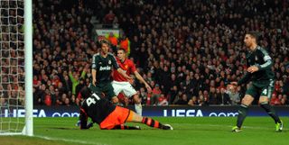 Real Madrid defender Sergio Ramos scores an own goal against Manchester United in the Champions League in March 2013.