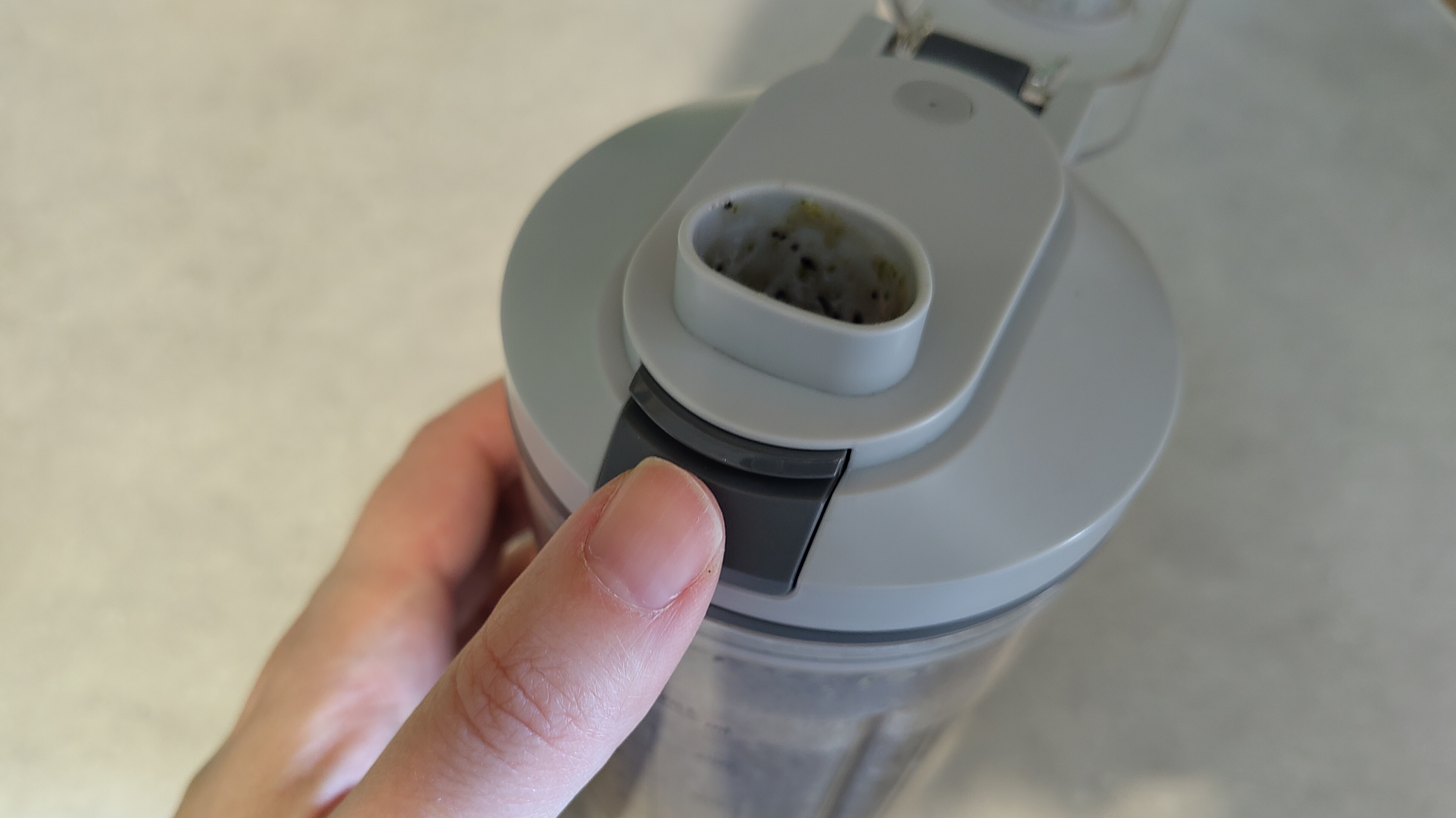 Opening flip-top lid on Ninja Blast Max blender
