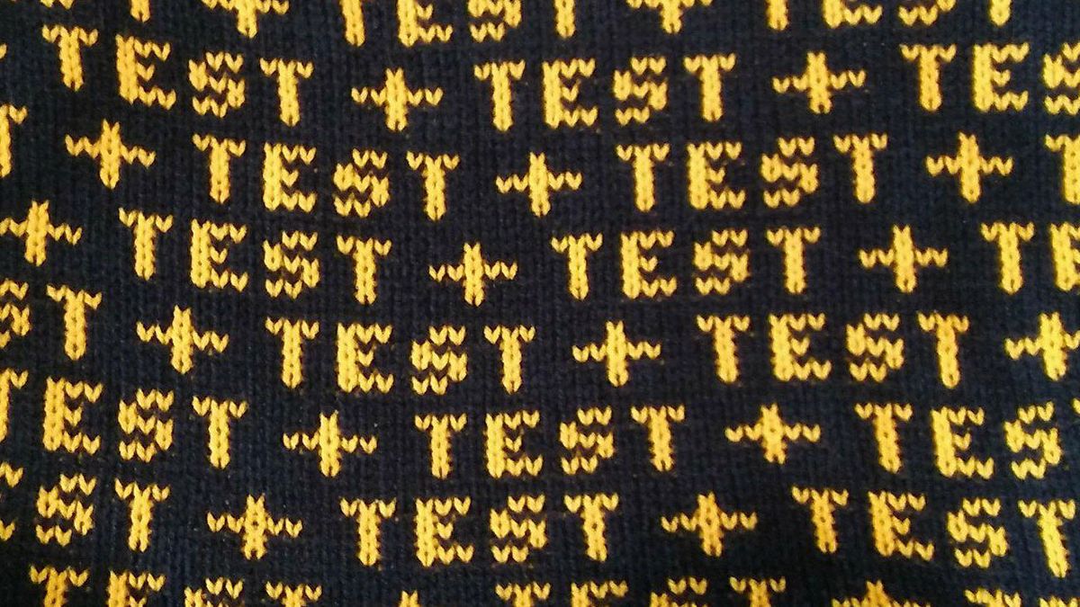 The word &#039;test&#039; knitted on a length of wool