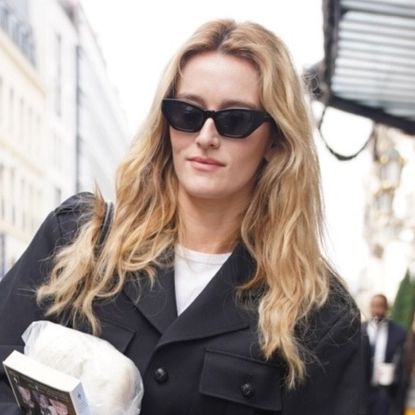 Sarah Pidgeon in Paris for Fashion Week wearing tailored jeans, on trend for Spring 2026, with black loafers