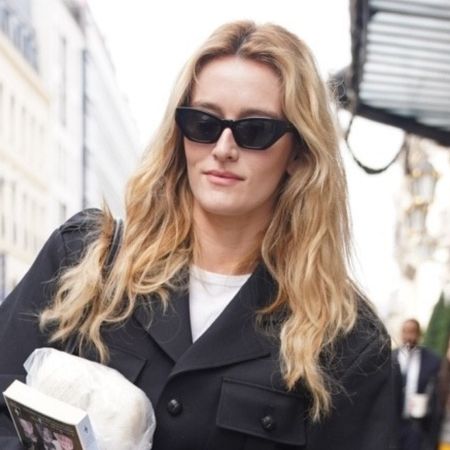 Sarah Pidgeon in Paris for Fashion Week wearing tailored jeans, on trend for Spring 2026, with black loafers