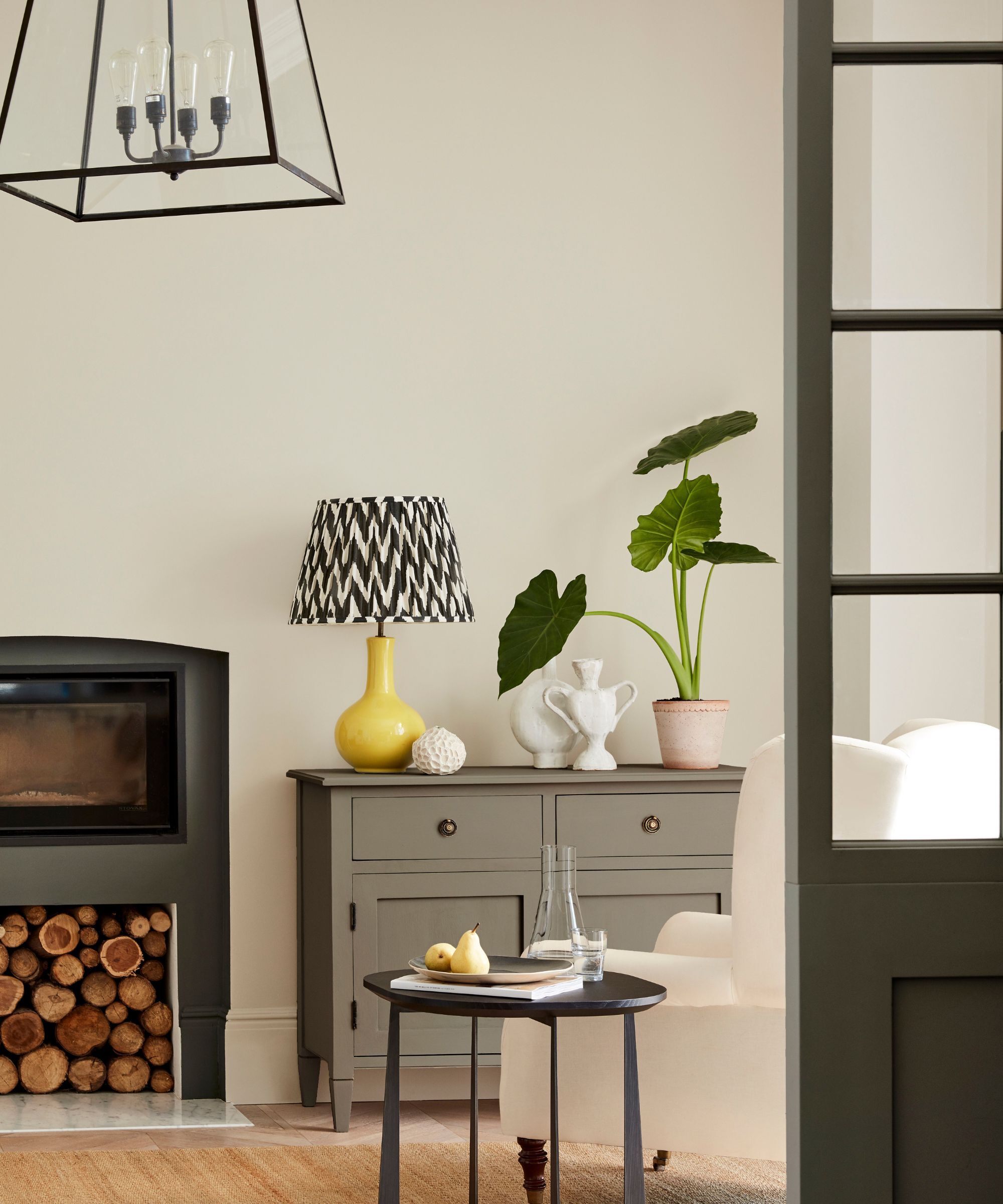 Sitting room with walls painted in Portland Stone by Little Greene