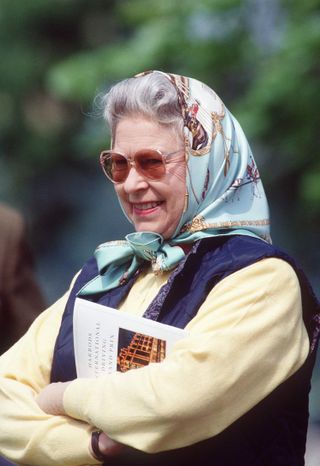 Queen Elizabeth wearing an Hermès Royal Mews scarf