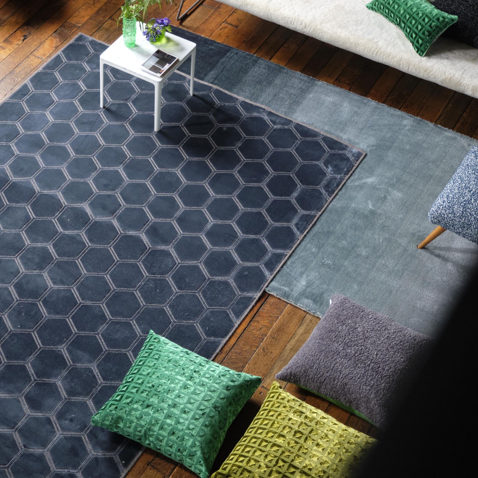 Designers Guild rug in living room with sofa