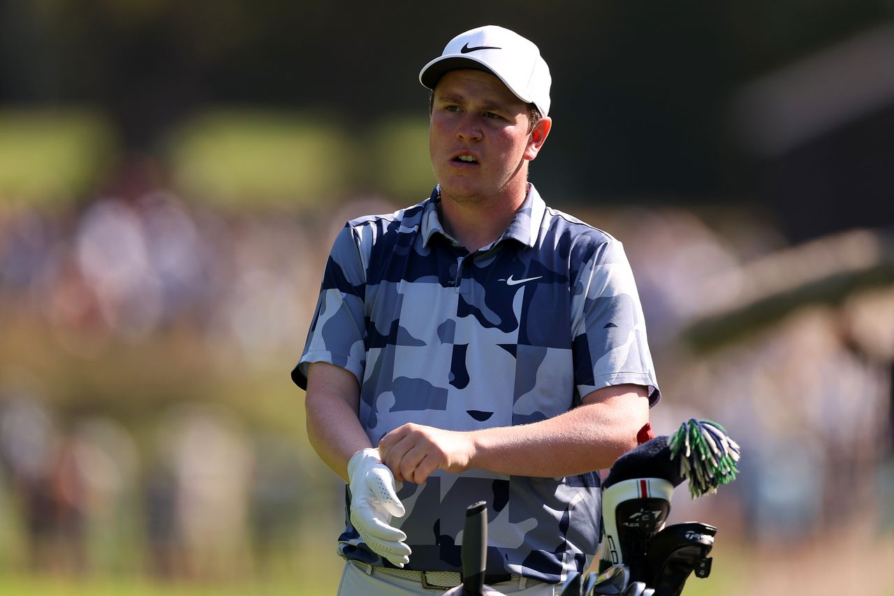 Robert MacIntyre of Scotland adjusts his glove on the 6th hole on Day Two of the BMW PGA Championship 