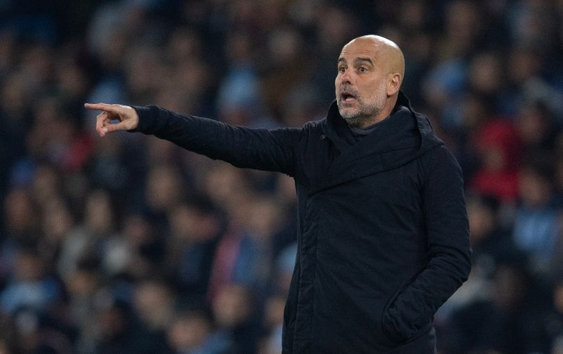 Manchester City manager Pep Guardiola standing on the touchline