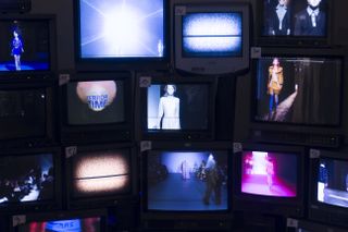 Runway shows played on a series of television screens
