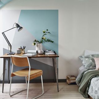 home office with fun featured wall and table lamp