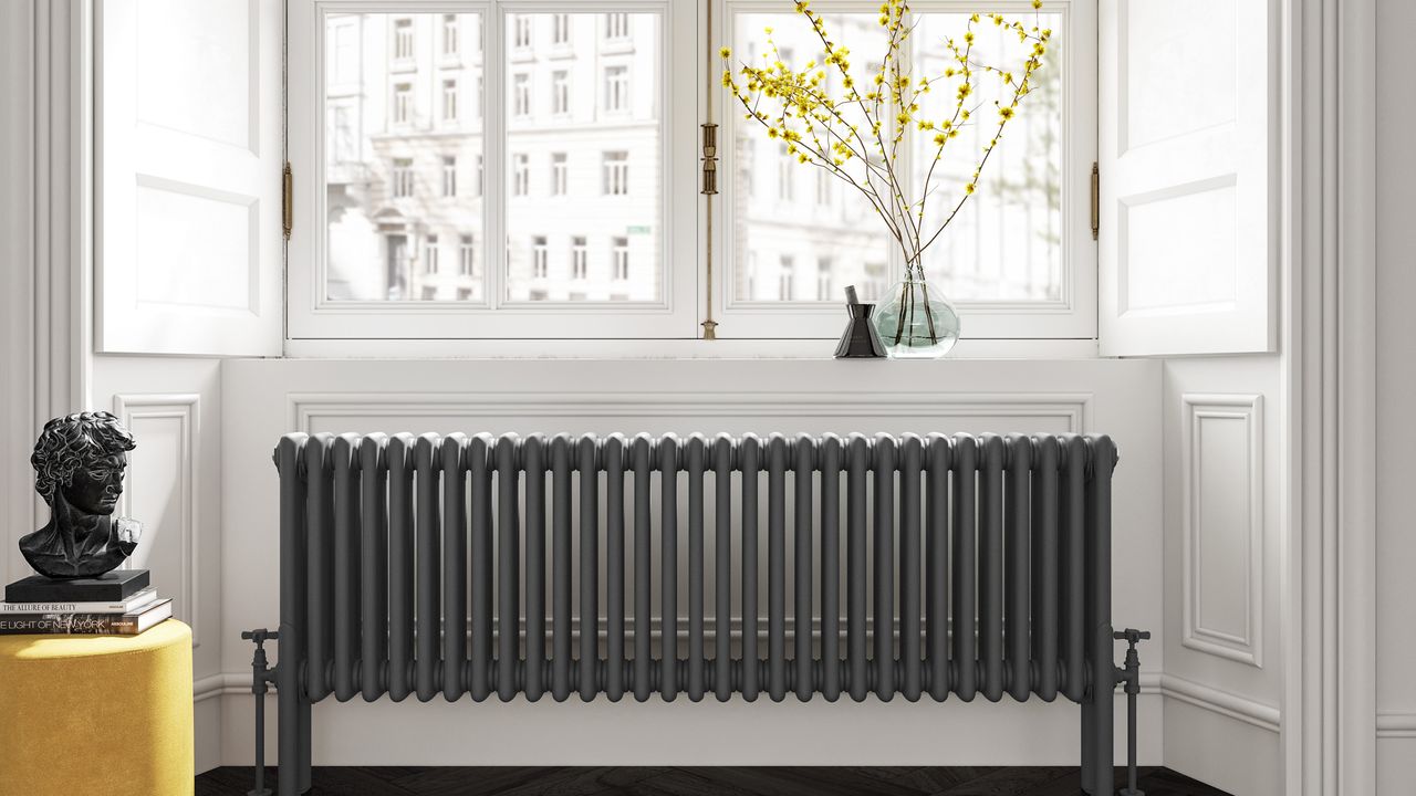 A bright living room with long dark radiator