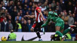 Chelsea goalkeeper Robert Sanchez chases after Brentford's Neal Maupay in the sides' Premier League clash at Stamford Bridge in October 2023.
