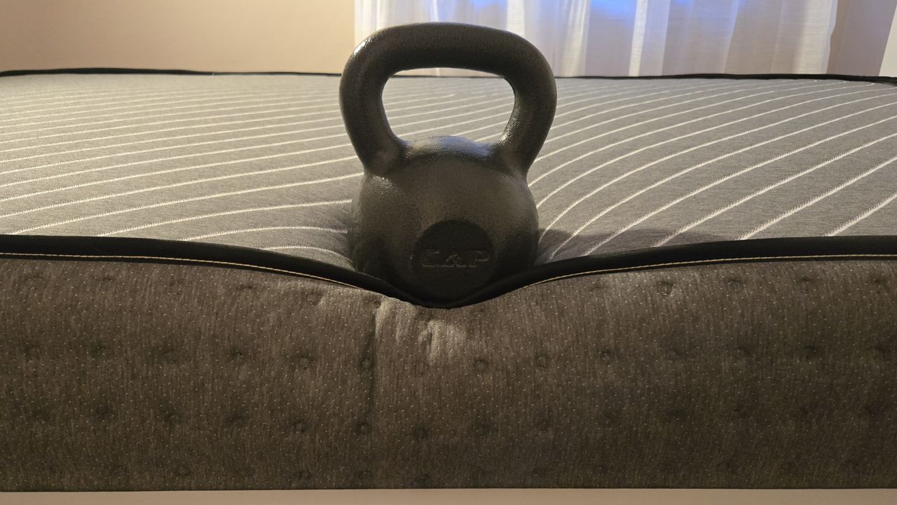 50lb weight on the perimeter of the Siena Premier Hybrid Mattress to gauge its edge support