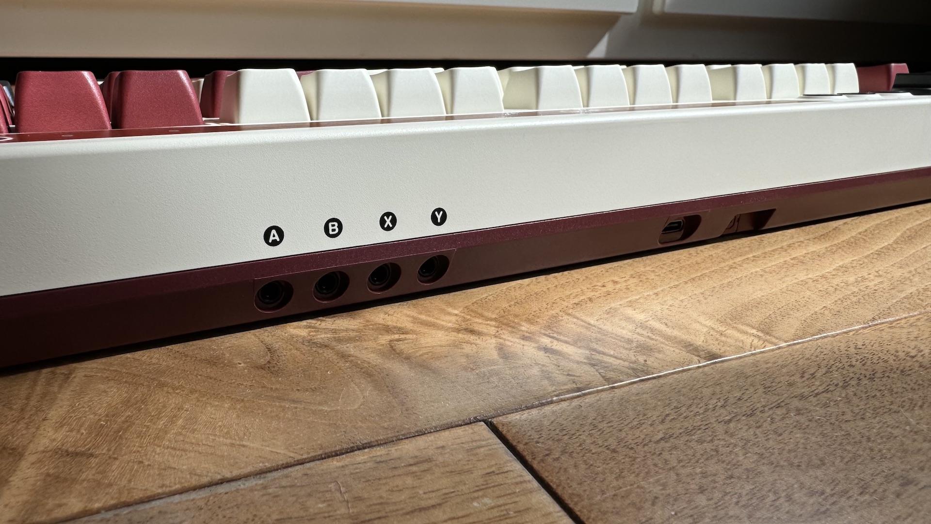 8BitDo Retro Mechanical Keyboard on a wooden floor