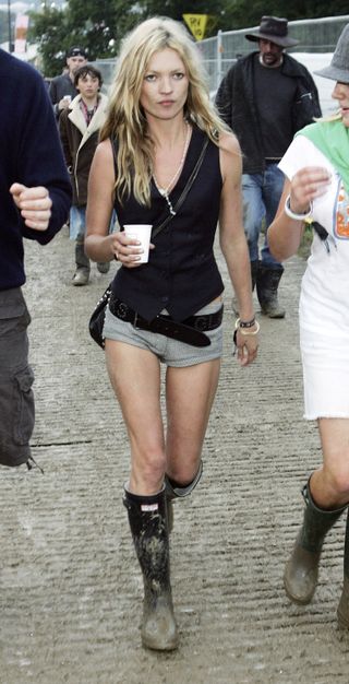 Kate Moss in rain boots at Glastonbury Festival in 2005.