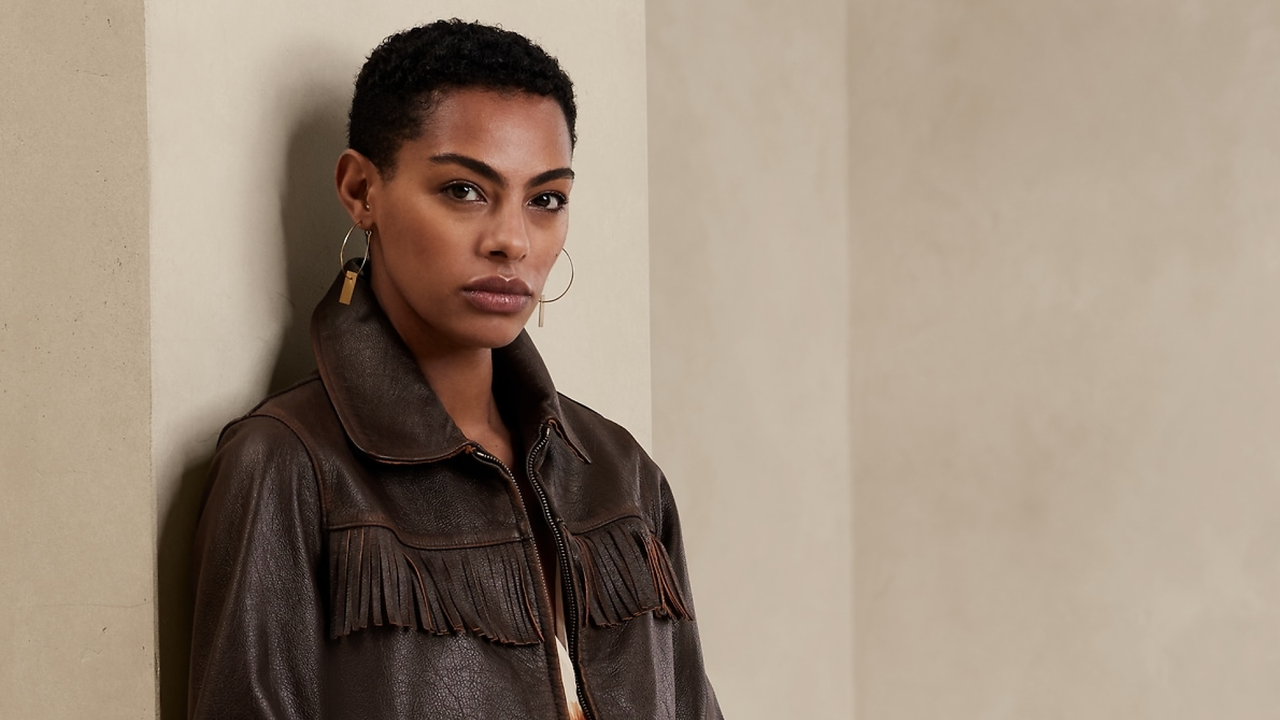 woman wearing a leather fringe jacket