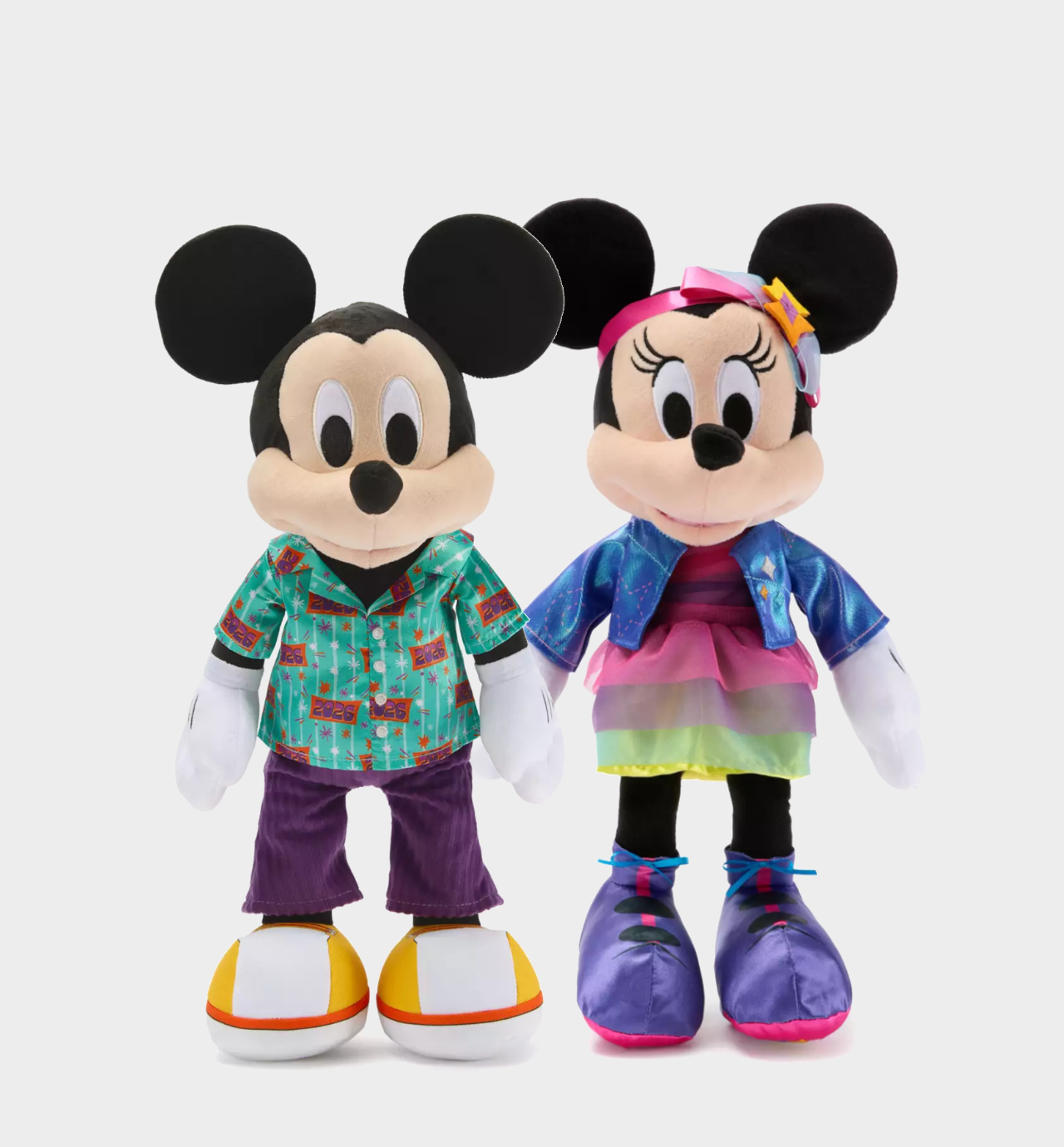 Mickey and Minnie Mouse plushies against a plain background