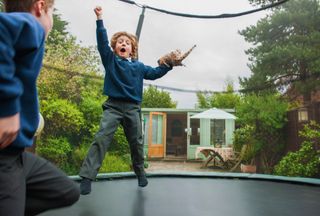 Boys jumping on a trampoline