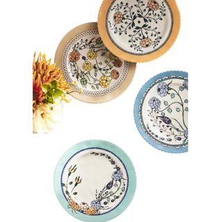 Anthropologie Turkuaz Kitchen dessert plates with a blue and floral motif. The edges are green, blue or yellow