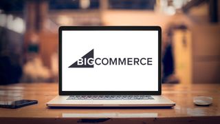 BigCommerce logo on laptop screen on a desk